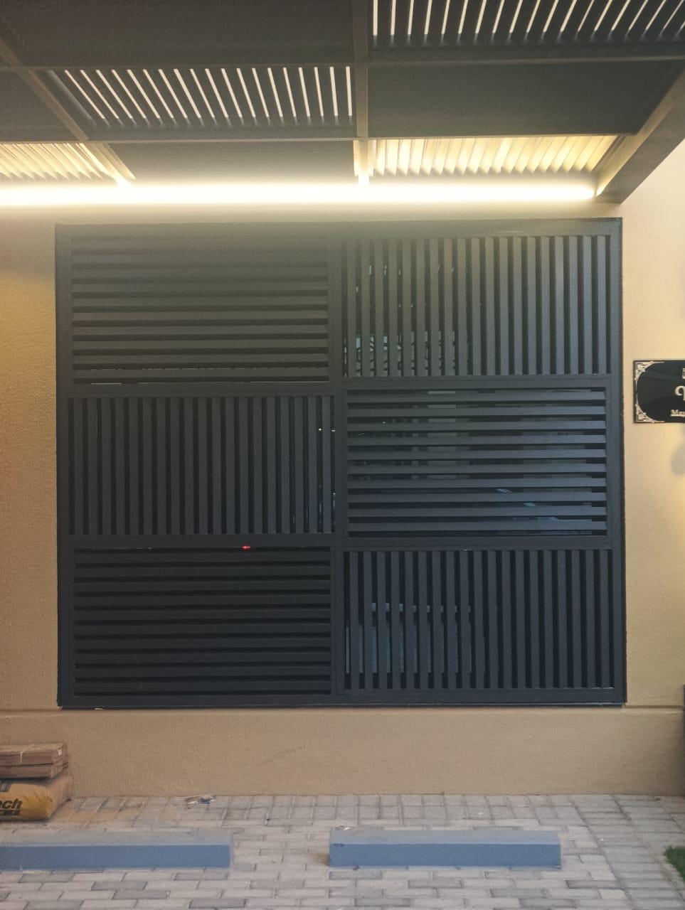 Laser cut wall panel under canopy