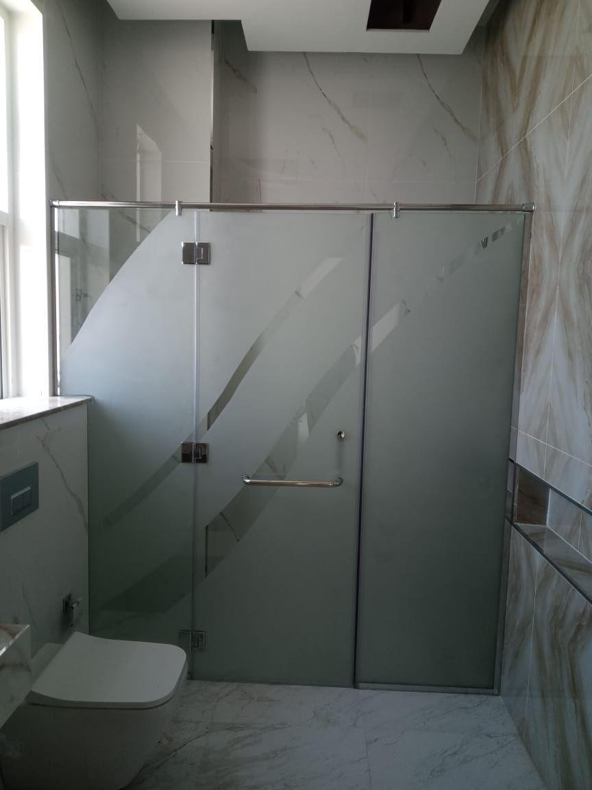 Glass shower partition in bathroom