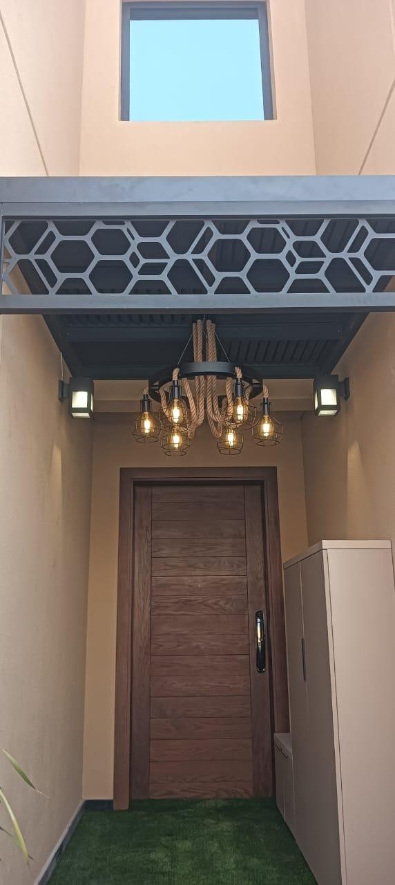 Hexagon canopy over entrance door