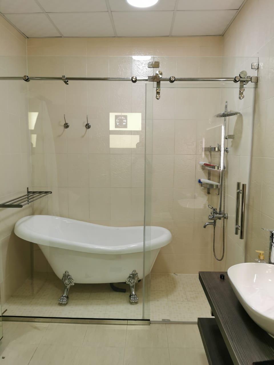 Glass shower with freestanding tub