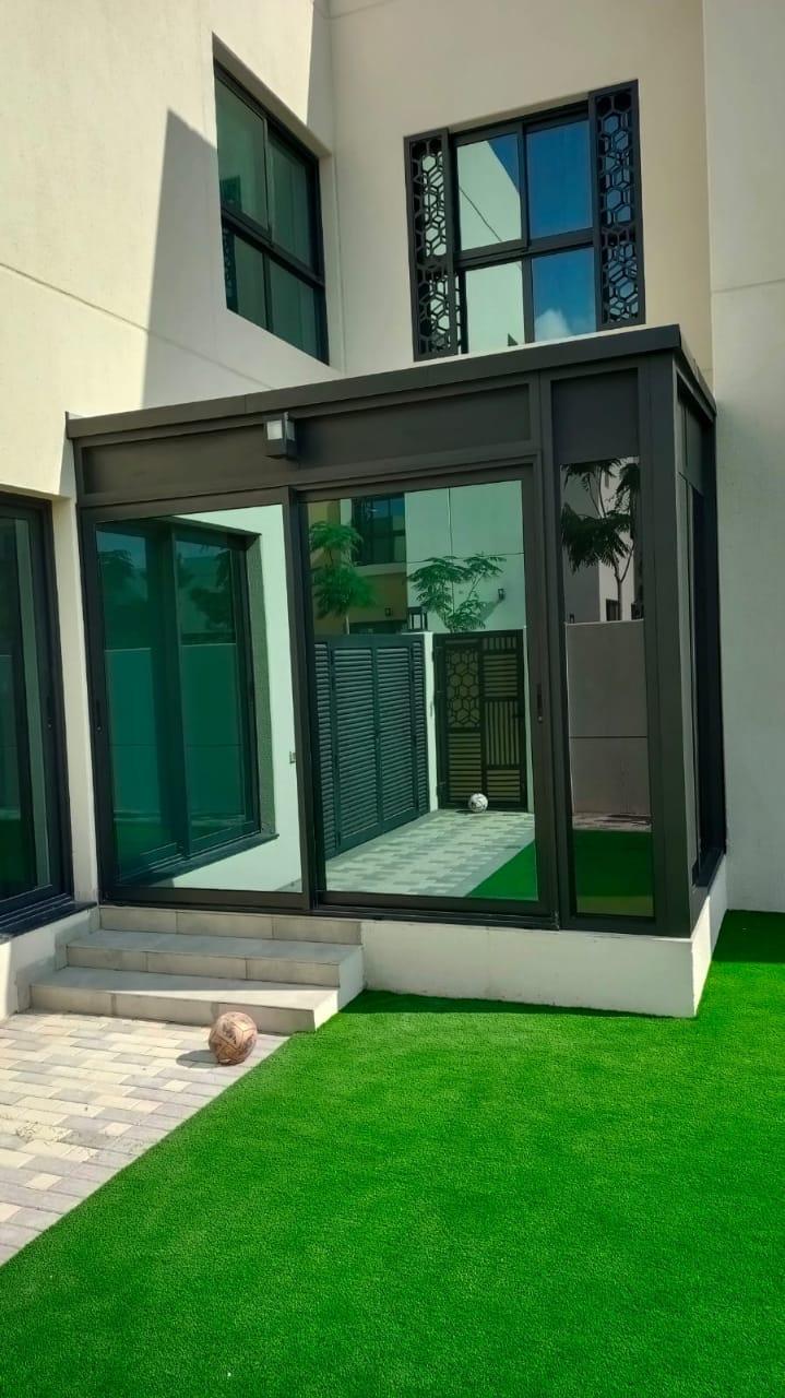 Glass sunroom in villa garden